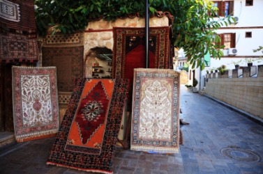 Carpets for sale in an outdoor market. Carpets for sale in an outdoor market.