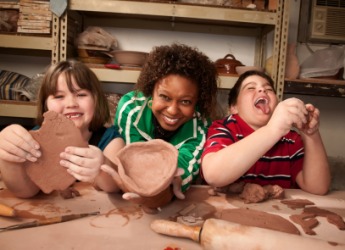 A ceramist and her students. A ceramist and her students.
