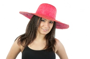 A woman in a pink chapeau. A woman in a pink chapeau.