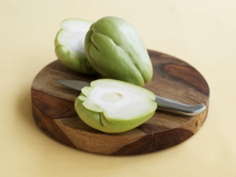 One whole and one sliced chayote. One whole and one sliced chayote.
