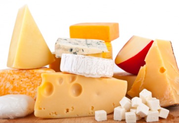 A stack of various types of cheese. A stack of various types of cheese.