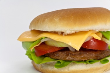 A cheeseburger with lettuce and tomato. A cheeseburger with lettuce and tomato.