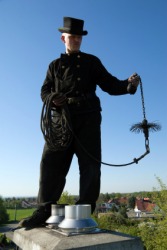 A chimney sweep at work. A chimney sweep at work.