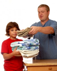 A father and son doing chores. A father and son doing chores.