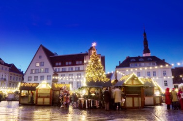 A village market square at Christmastime. A village market square at Christmastime.
