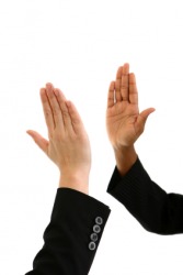 Two people about to clap their hands together. Two people about to clap their hands together.