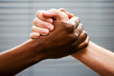 Two hands clasped together. Two hands clasped together.
