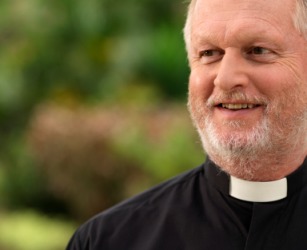 A priest in his clerical collar. A priest in his clerical collar.