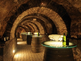 Barrels in an old wine cellar. Barrels in an old wine cellar.