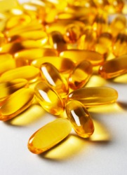 Several capsules containing cod-liver oil. Several capsules containing cod-liver oil.