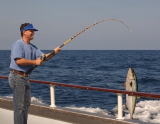 A man deep-sea fishing. A man deep-sea fishing.
