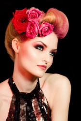 A womans coiffure decorated with flowers. A womans coiffure decorated with flowers.