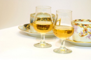 Two glasses of dessert wine. Two glasses of dessert wine.