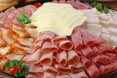 A variety of cold cuts on a platter. A variety of cold cuts on a platter.