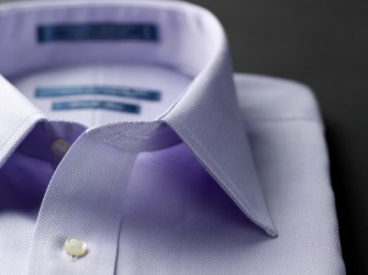 The collar of a mans shirt. The collar of a mans shirt.