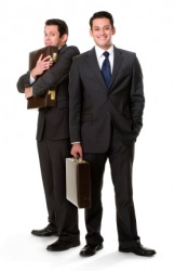 The timid man could be called the alter ego of the confident man in front. The timid man could be called the alter ego of the confident man in front.