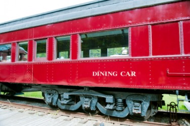 A railway dining car. A railway dining car.