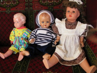 Three antique dolls. Three antique dolls.