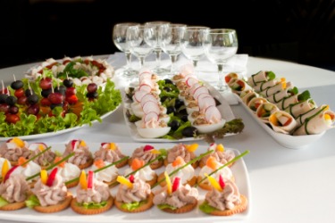 Plates filled with different appetizers. Plates filled with different appetizers.