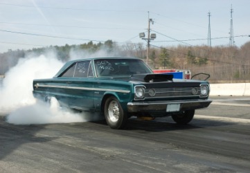 A car at in a drag race. A car at in a drag race.