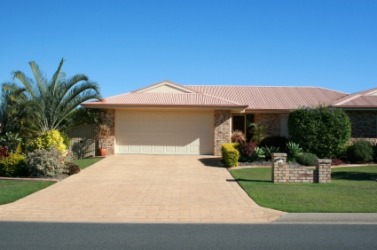 A house with a wide driveway. A house with a wide driveway.