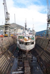 A boat in dry dock waiting for repairs. A boat in dry dock waiting for repairs.