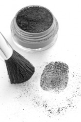 A specific dusting powder is being used to detect fingerprints. A specific dusting powder is being used to detect fingerprints.