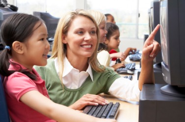 A child using a computer as part of her education. A child using a computer as part of her education.