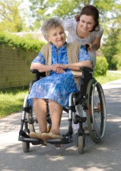 An elderly woman in a wheelchair. An elderly woman in a wheelchair.