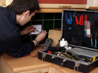 An electrician at work. An electrician at work.