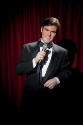 A man acting as emcee at an event. A man acting as emcee at an event.