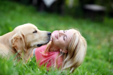 An endearing moment between a girl and her dog. An endearing moment between a girl and her dog.