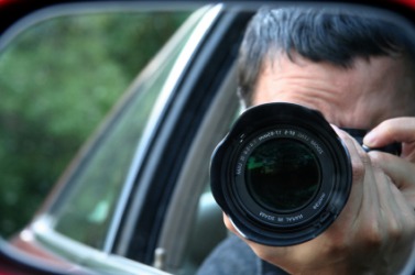 A man engaged in espionage. A man engaged in espionage.