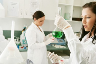 A scientist perfoms an experiment. A scientist perfoms an experiment.