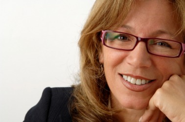 A woman wearing a pair of eyeglasses. A woman wearing a pair of eyeglasses.
