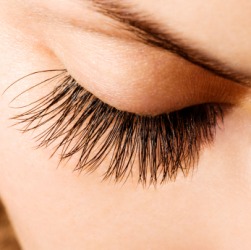 A woman with long eyelashes. A woman with long eyelashes.