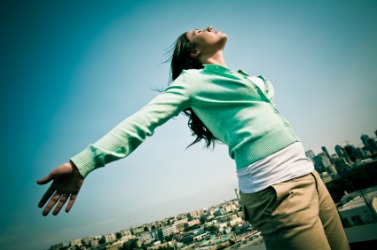 A woman enjoys a fancy-free moment. A woman enjoys a fancy-free moment.