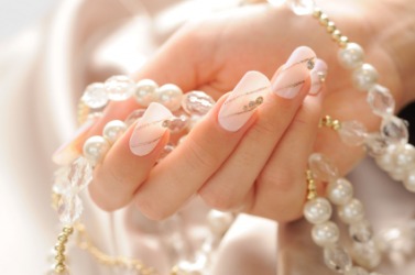Elaborately manicured fingernails. Elaborately manicured fingernails.