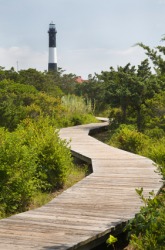 Boardwalk leading to the lighthouse on Fire Island. Boardwalk leading to the lighthouse on Fire Island.