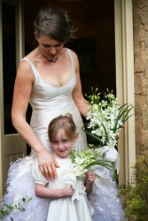 A bride and her flower girl. A bride and her flower girl.