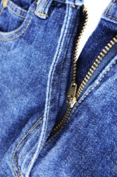 Pants with a fly front closing. Pants with a fly front closing.
