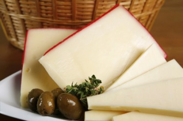 A plate of fontina cheese. A plate of fontina cheese.