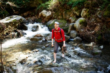 A man at a ford in a stream. A man at a ford in a stream.