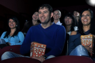 An audience at a movie theater. An audience at a movie theater.