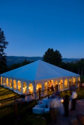 A tent set up for a gala evening event. A tent set up for a gala evening event.
