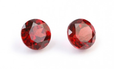 A pair of faceted garnets. A pair of faceted garnets.