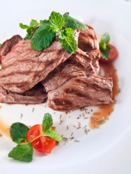 Roast lamb with a garnish of mint. Roast lamb with a garnish of mint.