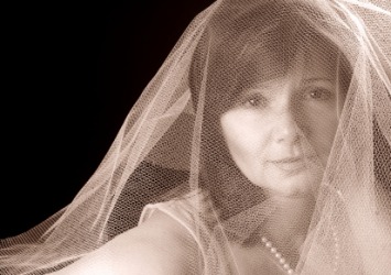 A woman in a gauzy veil. A woman in a gauzy veil.