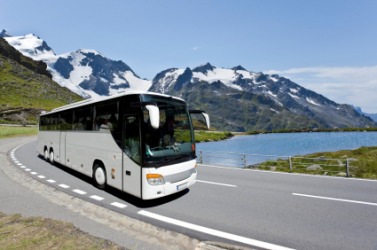 An autobus, or bus, on a highway. An autobus, or bus, on a highway.