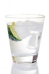 A glass of gin and tonic on ice. A glass of gin and tonic on ice.